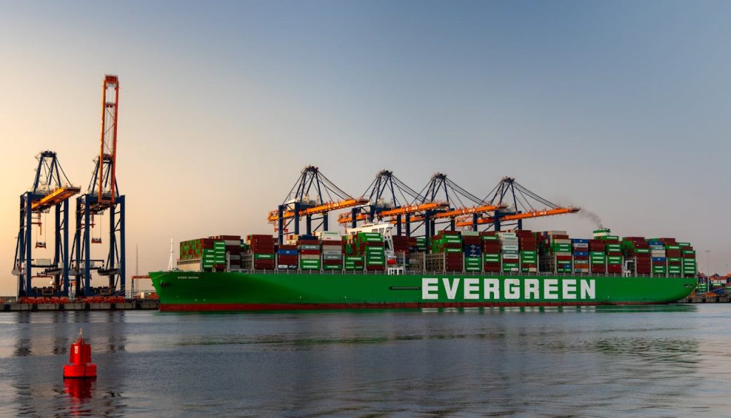 A colossal Evergreen container ship at the bustling Port of Rotterdam, Maasvlakte, Zuid-Holland.
